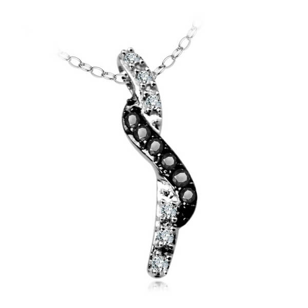 piękny wisiorek z czarnymi i białymi diamentami w białym złocie