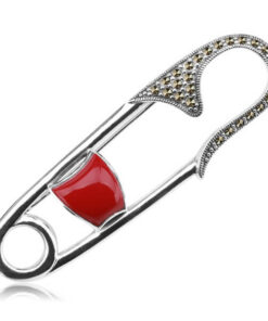 Srebrna broszka w kształcie agrafki z markazytami i koralem