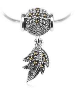 Srebrny wisiorek przekładany z piórkiem i markazytami