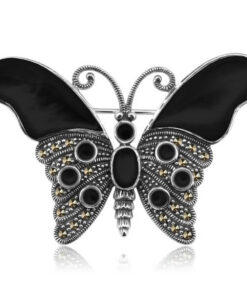 Broszka srebrna motyl z onyksami i markazytami