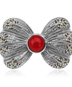 Broszka srebrna kokarda z markazytami i koralem