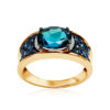 dostojny złoty pierścionek z topazem i szafirami